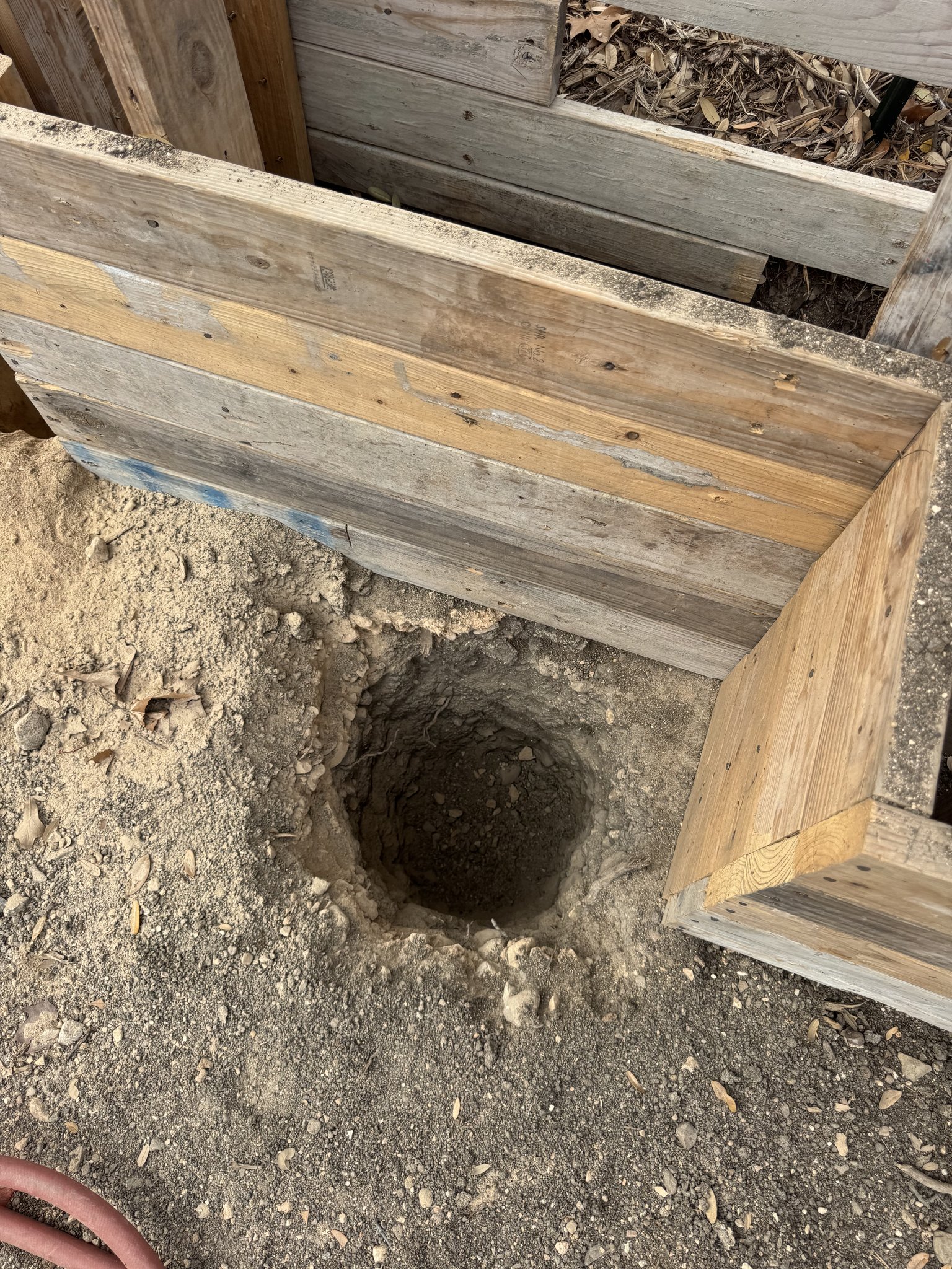 Pier hole excavation with root protection measures at Austin construction site